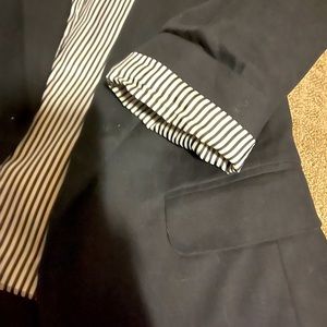 Ann Taylor Black blazer with cropped black and white fold-over sleeves.
